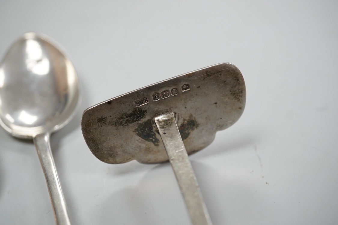 A continental white metal beaker, 69mm, five late Victorian silver coffee spoons, a silver pusher and butter knife and three white metal items.